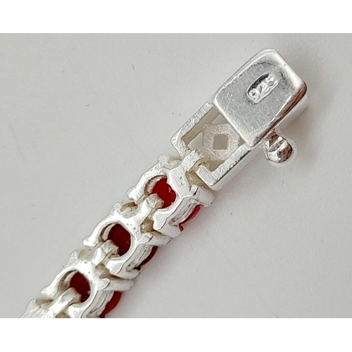 886 - A Ruby Gemstone Tennis Bracelet set in 925 Silver. 20cm.