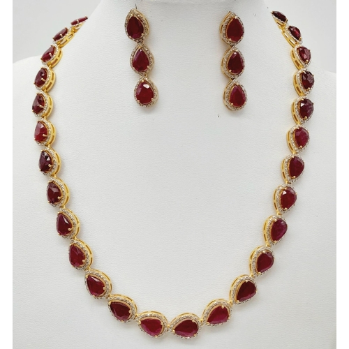 46 - A Pear-Cut Ruby Gemstone Tennis Necklace (42cm) with a Halo of Diamonds in a Pave Setting. Set in 92... 