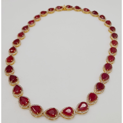 46 - A Pear-Cut Ruby Gemstone Tennis Necklace (42cm) with a Halo of Diamonds in a Pave Setting. Set in 92... 