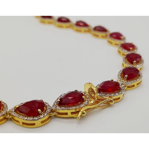 46 - A Pear-Cut Ruby Gemstone Tennis Necklace (42cm) with a Halo of Diamonds in a Pave Setting. Set in 92... 