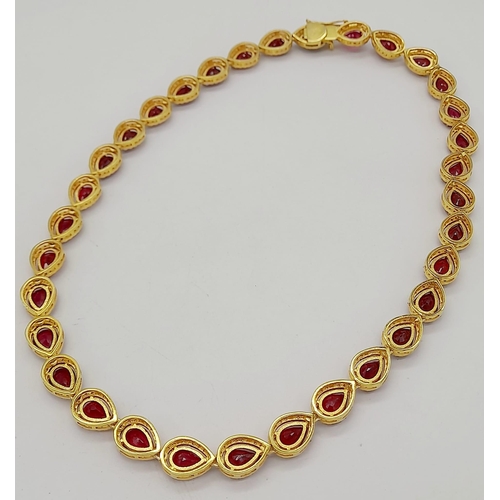 46 - A Pear-Cut Ruby Gemstone Tennis Necklace (42cm) with a Halo of Diamonds in a Pave Setting. Set in 92... 