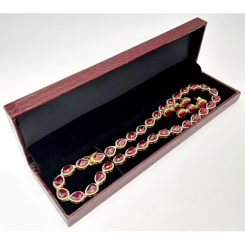 46 - A Pear-Cut Ruby Gemstone Tennis Necklace (42cm) with a Halo of Diamonds in a Pave Setting. Set in 92... 