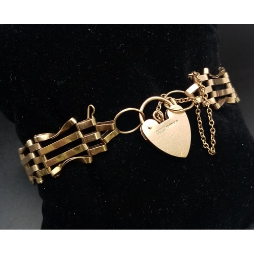 744 - Vintage 9 carat GOLD GATE BRACELET Complete with gold heart padlock and gold safety chain. 9.2 grams... 