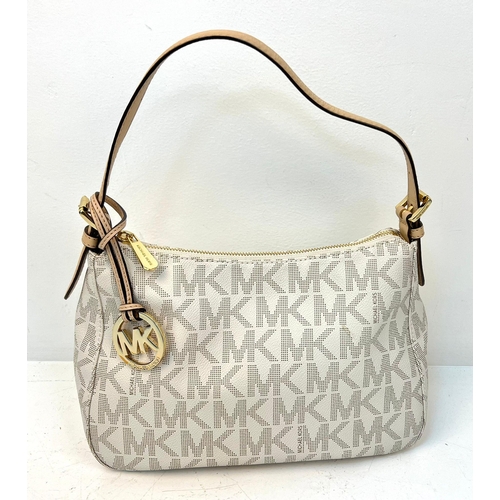 855 - Michael Kors Cream Monogram Bag with Gold Tone Hardware. 19cm x 31cm x 12cm.