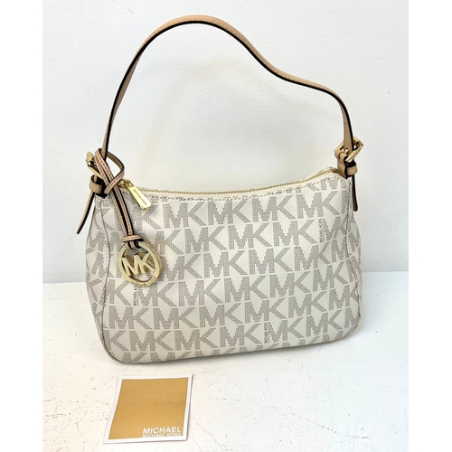 855 - Michael Kors Cream Monogram Bag with Gold Tone Hardware. 19cm x 31cm x 12cm.