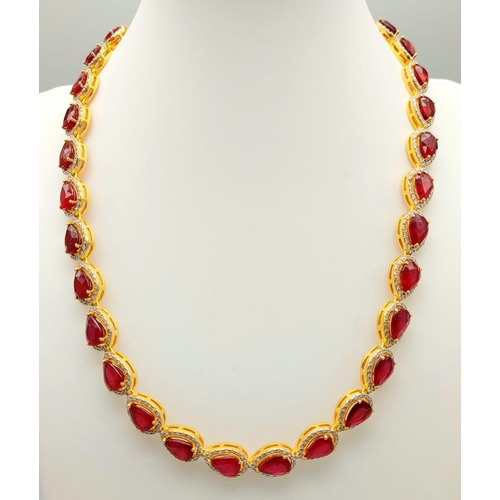 46 - A Pear-Cut Ruby Gemstone Tennis Necklace (42cm) with a Halo of Diamonds in a Pave Setting. Set in 92... 