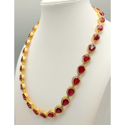 46 - A Pear-Cut Ruby Gemstone Tennis Necklace (42cm) with a Halo of Diamonds in a Pave Setting. Set in 92... 