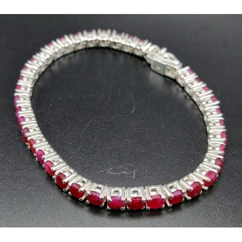 886 - A Ruby Gemstone Tennis Bracelet set in 925 Silver. 20cm.