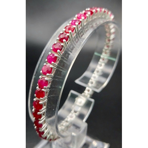 886 - A Ruby Gemstone Tennis Bracelet set in 925 Silver. 20cm.