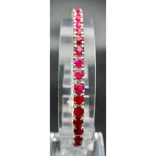 886 - A Ruby Gemstone Tennis Bracelet set in 925 Silver. 20cm.