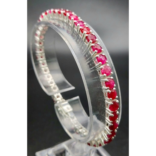 886 - A Ruby Gemstone Tennis Bracelet set in 925 Silver. 20cm.