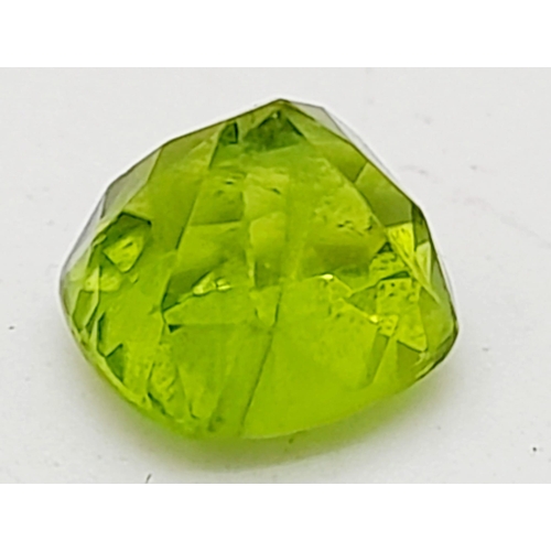 987 - A 2.24ct Cushion Cut Olive-Green Peridot with GGI Certification. An earth-mined gem of Pakistan orig... 