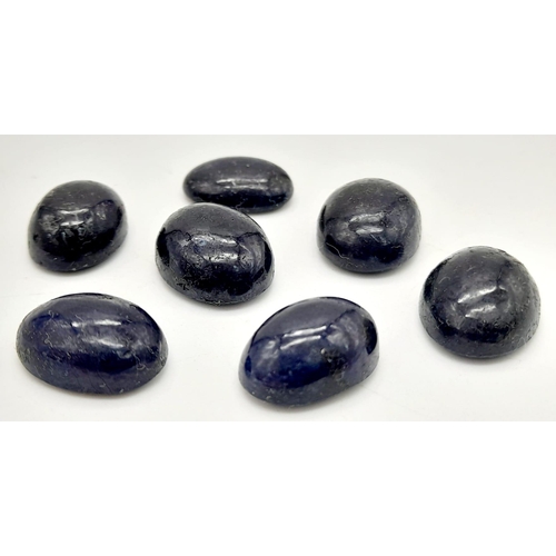 704 - A 60.75ct of 7pcs Cabochon Blue Sapphire Gemstones, in Oval Cabochon Shapes .