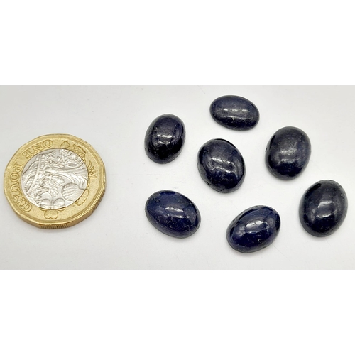 704 - A 60.75ct of 7pcs Cabochon Blue Sapphire Gemstones, in Oval Cabochon Shapes .