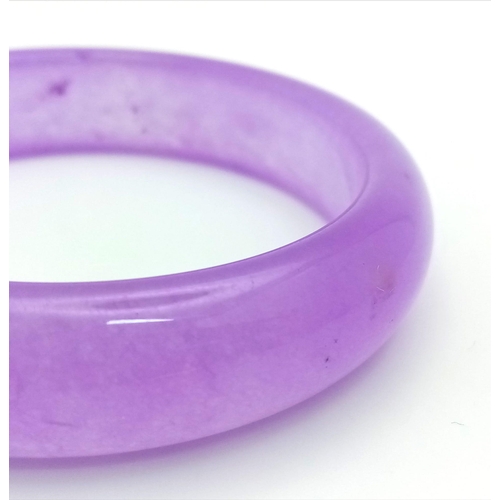 880 - A Beautiful Summer Lavender Jade Bangle. 6cm inner diameter. 2cm width