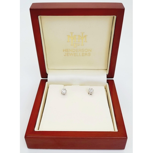 1090 - A Pair of 9K White Gold Diamond Stud Earrings. Two clean white clusters. 1.3g total weight. Comes in... 