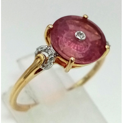 1273 - A 10k gold fancy cut pink tourmaline with a diamond centre and semi-circular diamond shoulders. Size... 