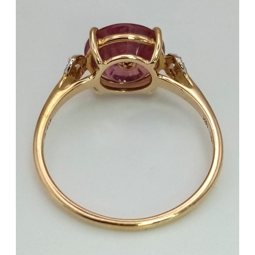 1273 - A 10k gold fancy cut pink tourmaline with a diamond centre and semi-circular diamond shoulders. Size... 