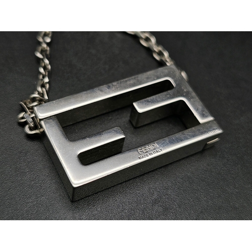 339 - A Fendi Logo White Metal Magnetic Pendant and Chain. 3.5cm and 44cm. Comes in a Fendi box. Ref: 1242... 