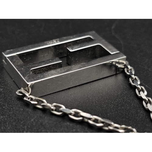 339 - A Fendi Logo White Metal Magnetic Pendant and Chain. 3.5cm and 44cm. Comes in a Fendi box. Ref: 1242... 