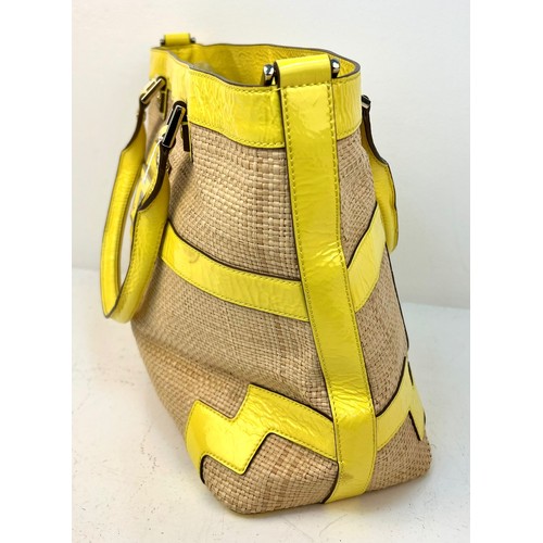 1157 - An Anya Hindmarch Patent Yellow Leather and Straw Small Tote Bag. Exterior magnetic pocket. Textile ... 