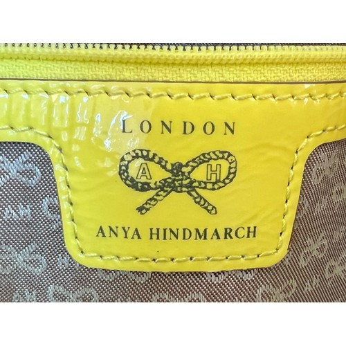 1157 - An Anya Hindmarch Patent Yellow Leather and Straw Small Tote Bag. Exterior magnetic pocket. Textile ... 