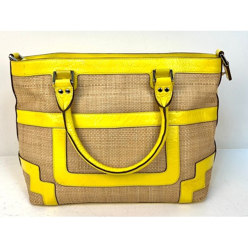 1157 - An Anya Hindmarch Patent Yellow Leather and Straw Small Tote Bag. Exterior magnetic pocket. Textile ... 