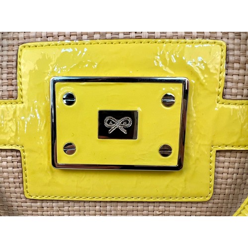 1157 - An Anya Hindmarch Patent Yellow Leather and Straw Small Tote Bag. Exterior magnetic pocket. Textile ... 