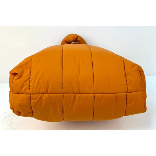 529 - A Kenzo Orange Costanza Puff Bag. Clip top button opening.
Shoulder strap. Dustcover. Interior zippe... 