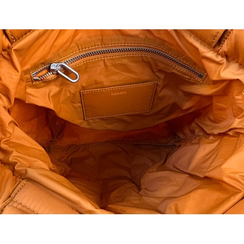 529 - A Kenzo Orange Costanza Puff Bag. Clip top button opening.
Shoulder strap. Dustcover. Interior zippe... 