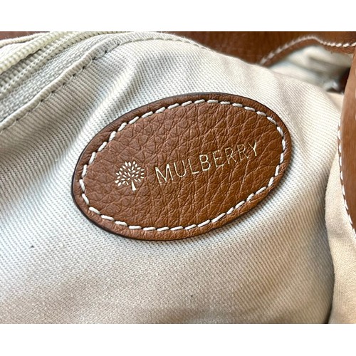 522 - A Mulberry Textured Brown Leather Handbag. Gold-tone hardware. Exterior zipped compartment. Cream te... 