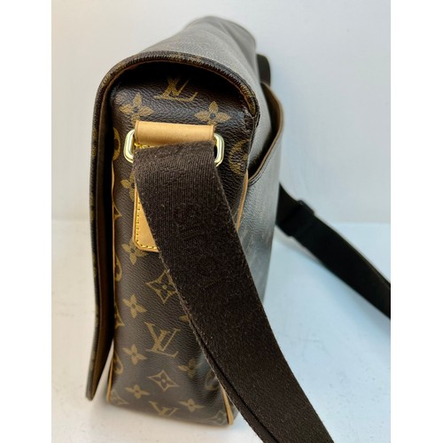 122 - A Louis Vuitton Large Flap Shoulder Bag and Dust Cover. LV monogram canvas. Gold-tone hardware. Thic... 