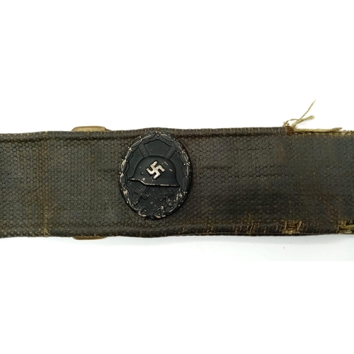 172 - WW2 British Belt with German Badges.