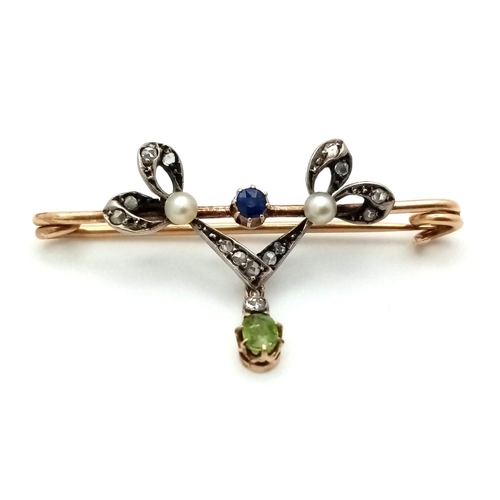 324 - A Superb Double Bow Sapphire Diamond and Pearl Brooch with a Demontoid Garnet and Diamond Drop set i... 