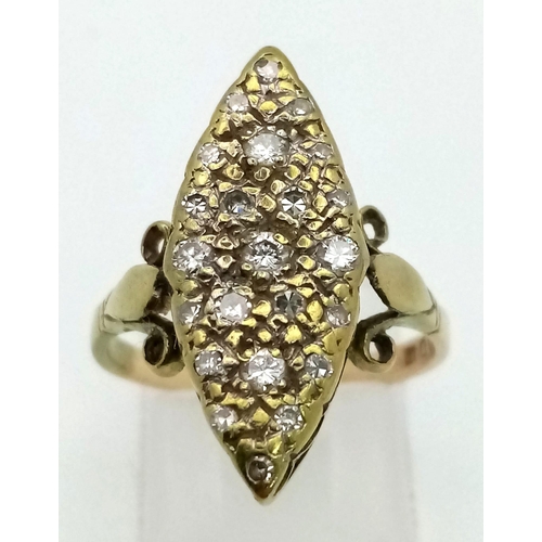 332 - An Antique Diamond Marquise Shaped Ring Finished with Scroll Shoulders. Size P. 4.31g total weight.