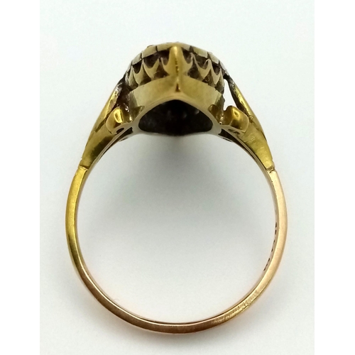 332 - An Antique Diamond Marquise Shaped Ring Finished with Scroll Shoulders. Size P. 4.31g total weight.