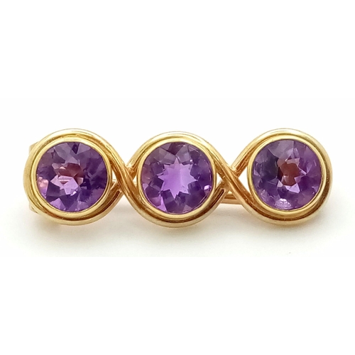 730 - A Vintage Amethyst Brooch Set In 15K Gold. 2cm. 2.32g total weight.