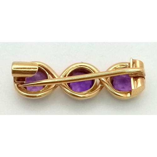 730 - A Vintage Amethyst Brooch Set In 15K Gold. 2cm. 2.32g total weight.