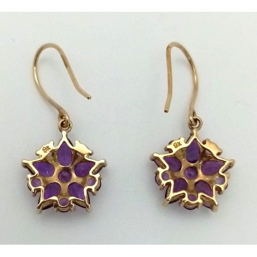 982 - A Pair of Fine Amethyst Star Shaped Cluster Drop Earrings Set in 9K Yellow Gold. 2.43g total weight.