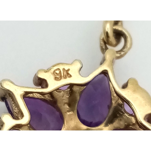 982 - A Pair of Fine Amethyst Star Shaped Cluster Drop Earrings Set in 9K Yellow Gold. 2.43g total weight.