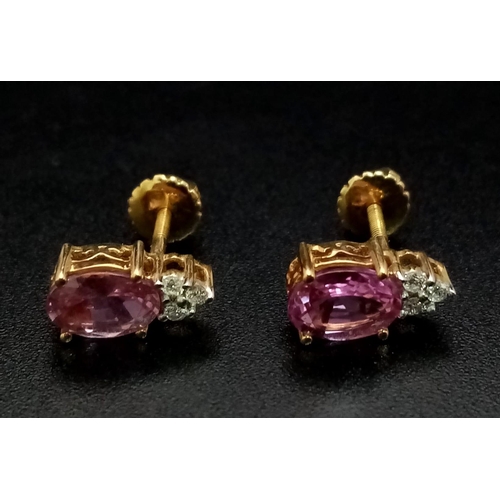 212 - A Fine Pair of Pink Sapphire and Diamond Earrings. Set in high karat gold. 2.48g total weight.