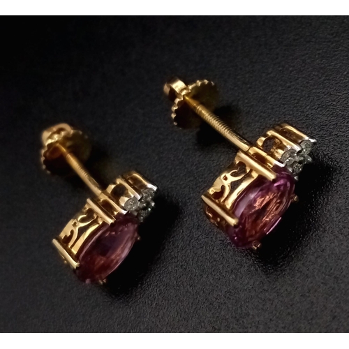 212 - A Fine Pair of Pink Sapphire and Diamond Earrings. Set in high karat gold. 2.48g total weight.