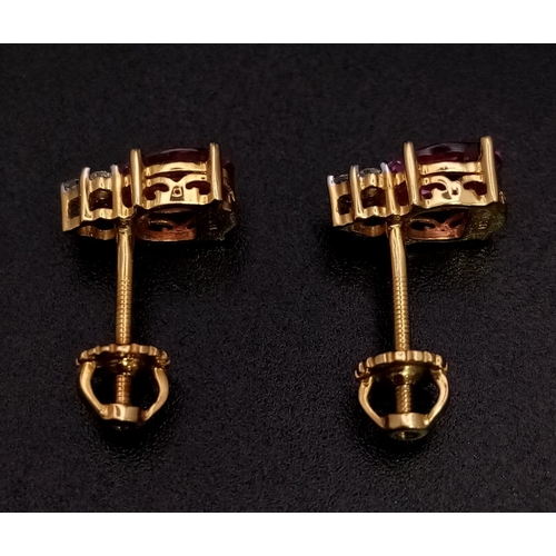 212 - A Fine Pair of Pink Sapphire and Diamond Earrings. Set in high karat gold. 2.48g total weight.