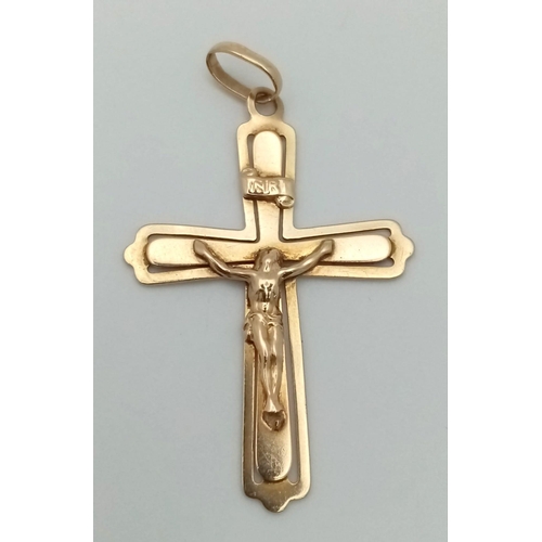 381 - 9k yellow gold crucifix pendant. Weighs 3.2g.  (H:4.5cm)