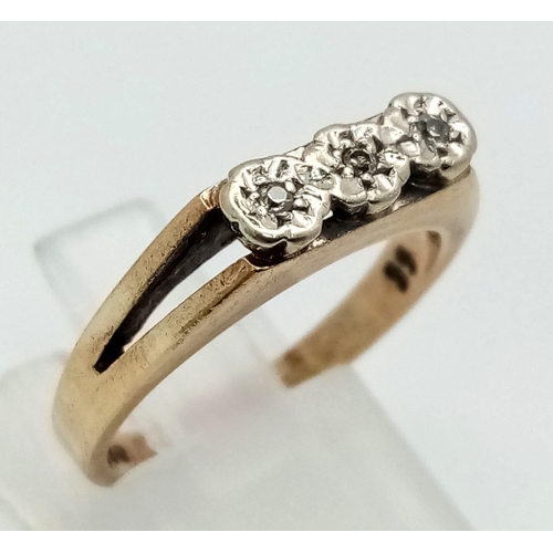 640 - 9k yellow gold trilogy split shoulder diamond ring. 0.03ct Diamond. Total Weight 3.4g. size N