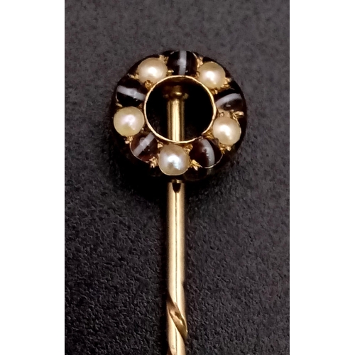 702 - A High-Karat Gold (tested) Antique Onyx Bullseye and Pearl Screw Top Stickpin. 5cm