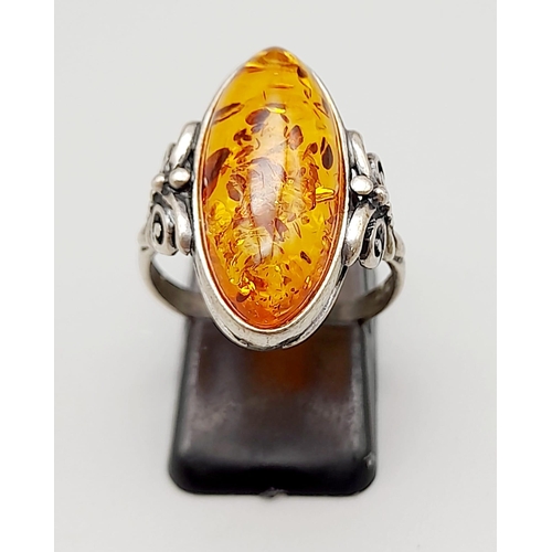 1056 - A Very Good Condition Vintage Sterling Silver and Amber Cabochon Ring Size Q. 2.2cm Length Boat Shap... 