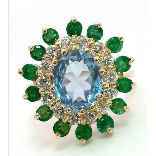 13 - 18K YELLOW GOLD DIAMOND, EMERALD & BLUE TOPAZ CLUSTER RING. TOTAL WEIGHT 6.4G SIZE O