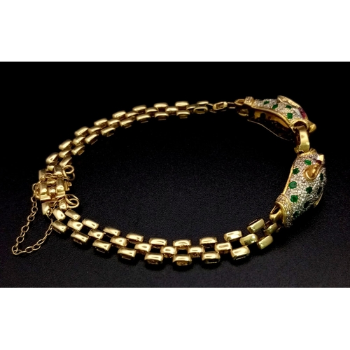 55 - A wonderful 18 K yellow gold designer style PANTHER bracelet with emeralds and diamonds and ruby eye... 