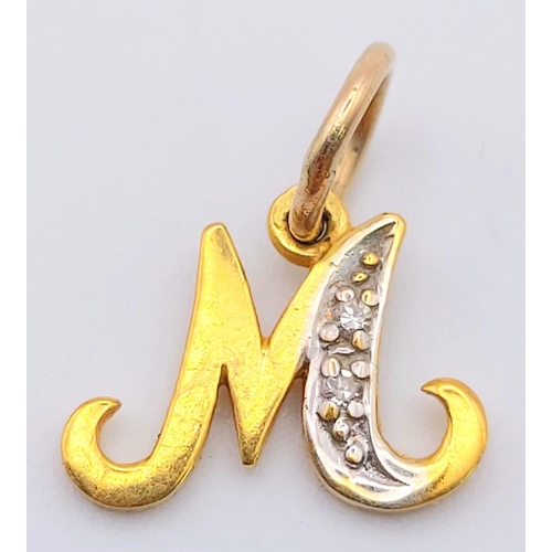 603 - A 14 K yellow gold diamond set pendant in the shape of the letter M. weight: 0.7 g.